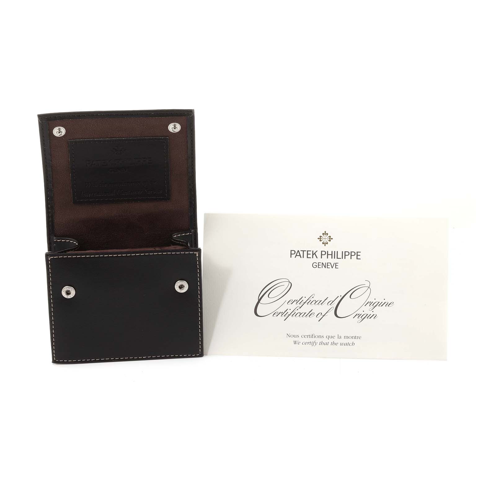 The image shows an open leather case and a certificate of origin for the Patek Philippe Twenty-4 4910-10A-012 Women
s Stainless Steel Blue Dial 4910-10A-012 Women
s Stainless Steel Blue Dial watch.