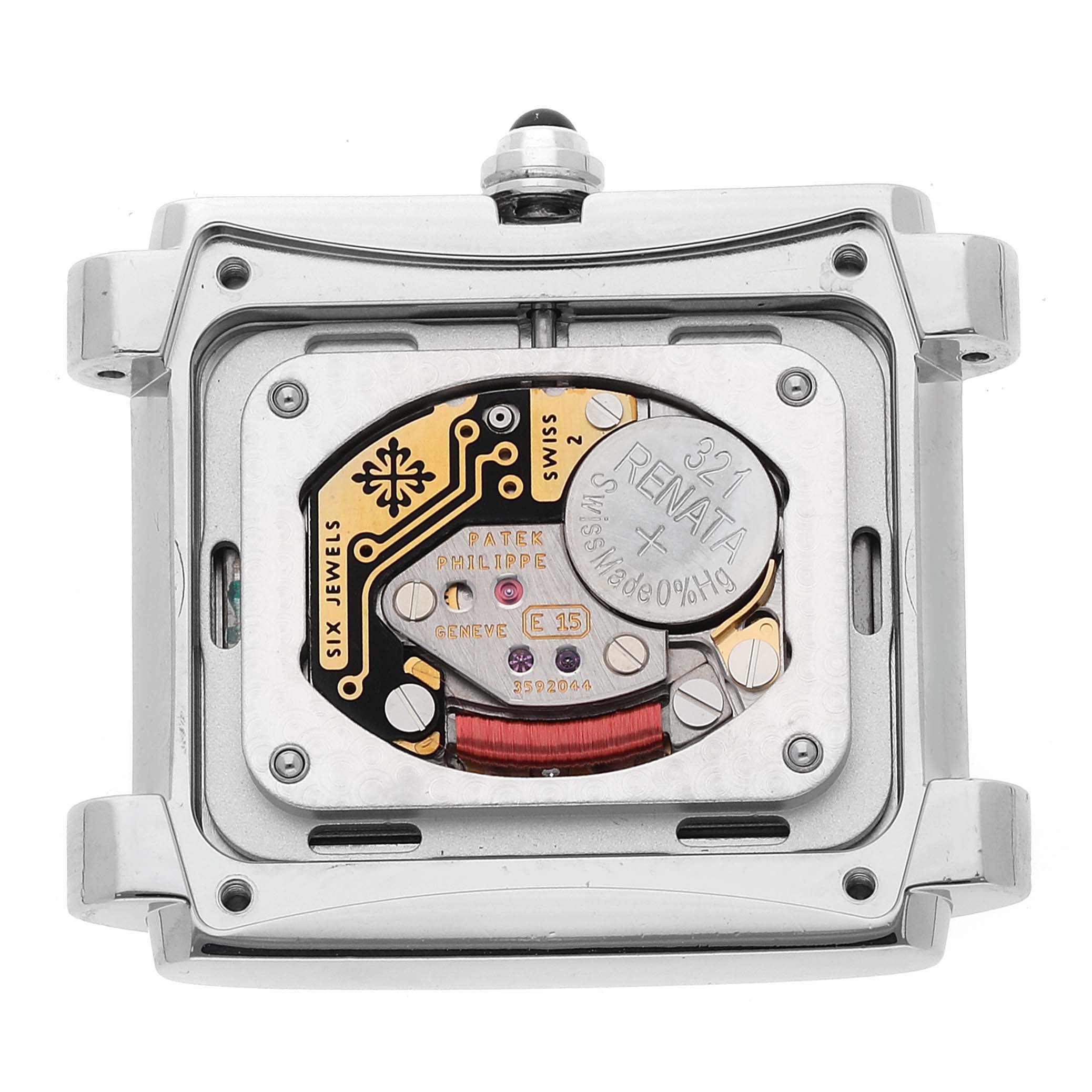 The image shows the open case back of a Patek Philippe Twenty-4 4910/10A-010 Women
s Stainless Steel Grey Dial 4910/10A-010 Women
s Stainless Steel Grey Dial watch, revealing its inner mechanism and battery.