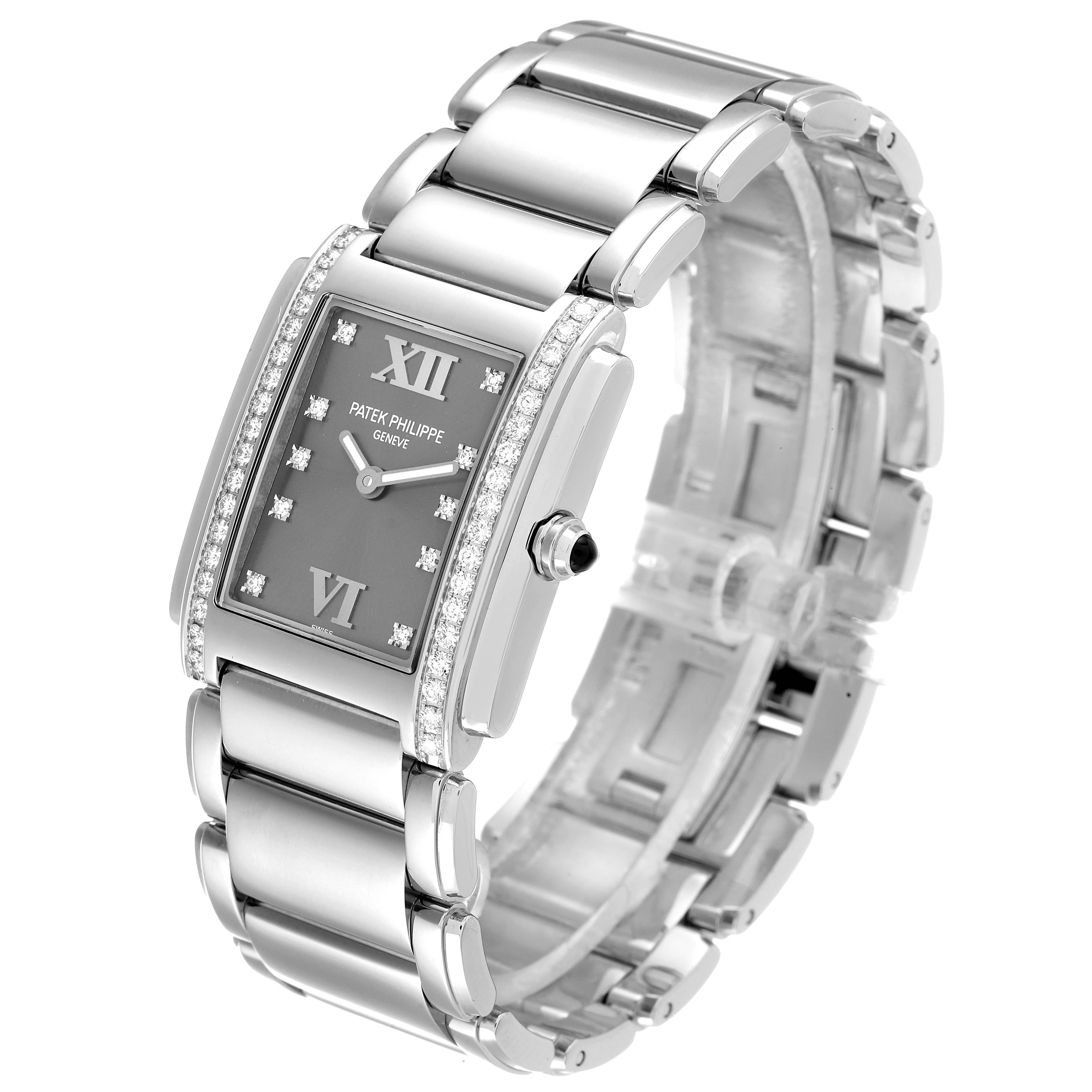 The image shows a Patek Philippe Twenty-4 4910/10A-010 Women
s Stainless Steel Grey Dial 4910/10A-010 Women
s Stainless Steel Grey Dial model watch at a three-quarter angle, highlighting its bracelet, dial, and side crown.