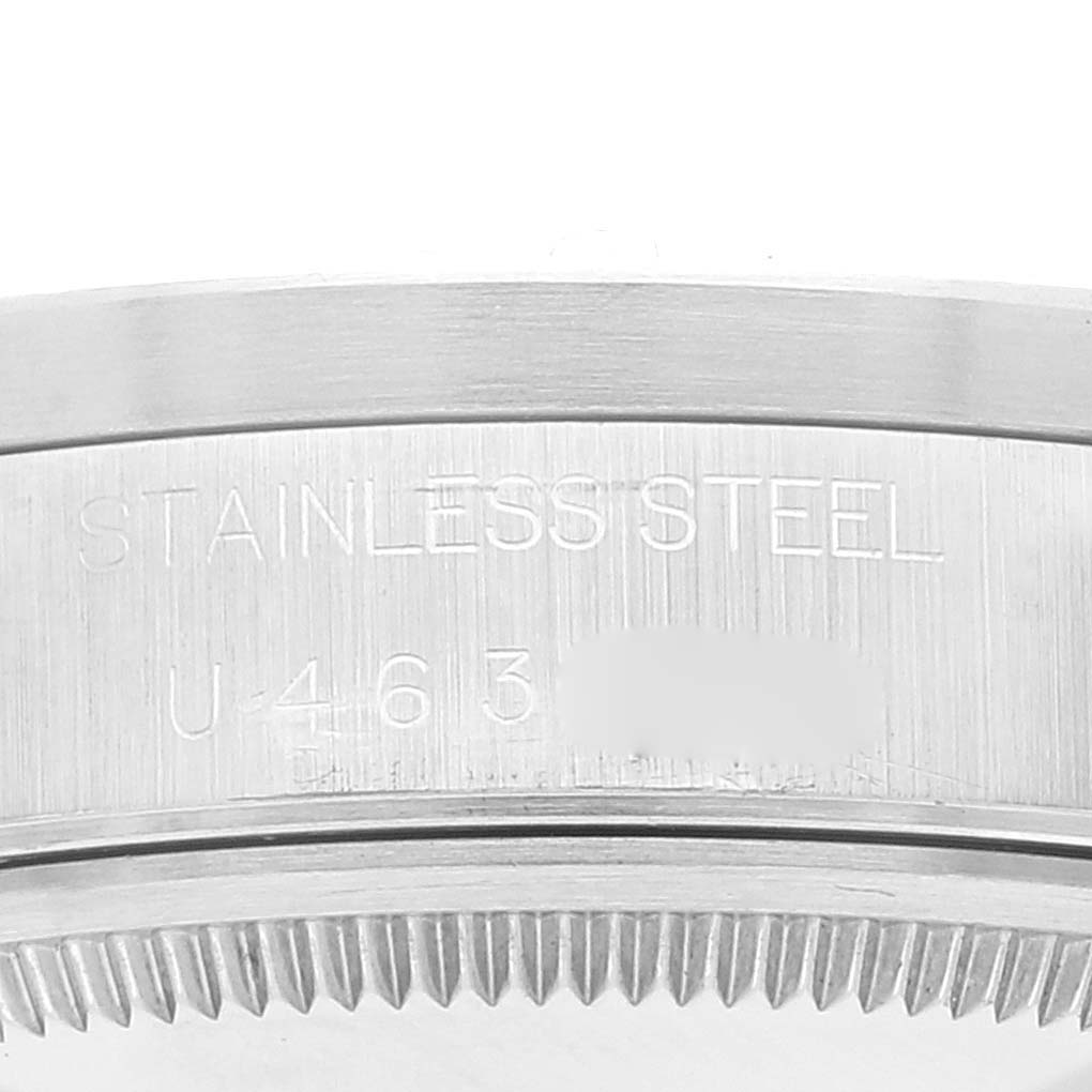 This image shows the side view of the stainless steel casing with engravings of the Rolex Air-King 14010 Men's Stainless Steel Blue Dial 14010 Men's Stainless Steel Blue Dial model.