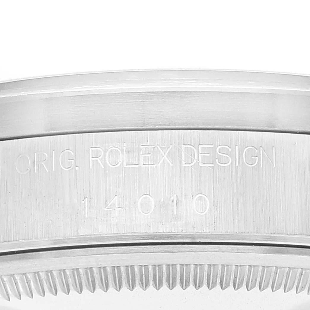The image shows a close-up view of the side with the inscription "ORIG. ROLEX DESIGN 14010" on the Rolex Air-King 14010 Men's Stainless Steel Blue Dial 14010 Men's Stainless Steel Blue Dial watch casing.
