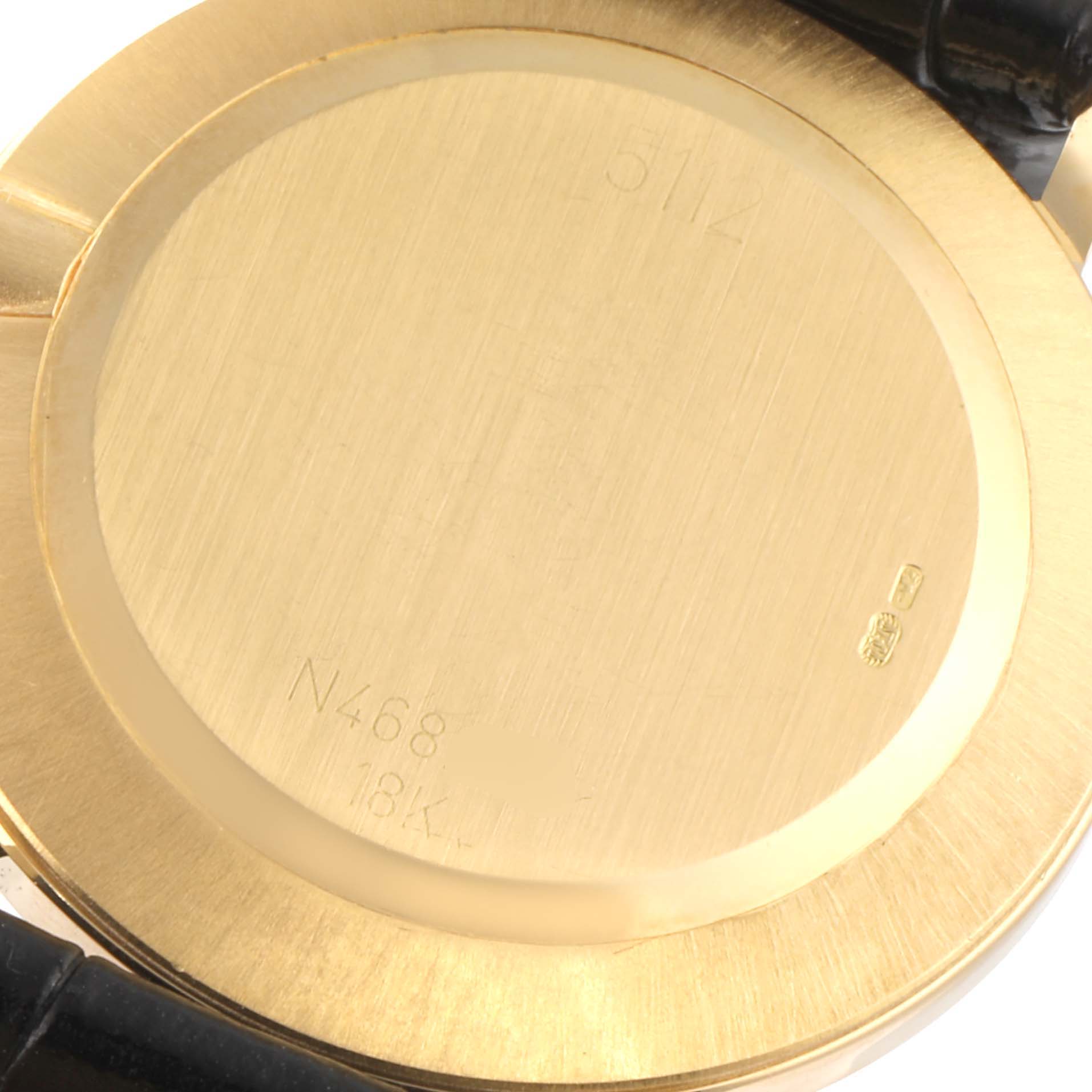 The image shows the back case of a Rolex Cellini 5112 Men's Yellow Gold Champagne Dial 5112 Men's Yellow Gold Champagne Dial watch, highlighting its inscriptions and markings.