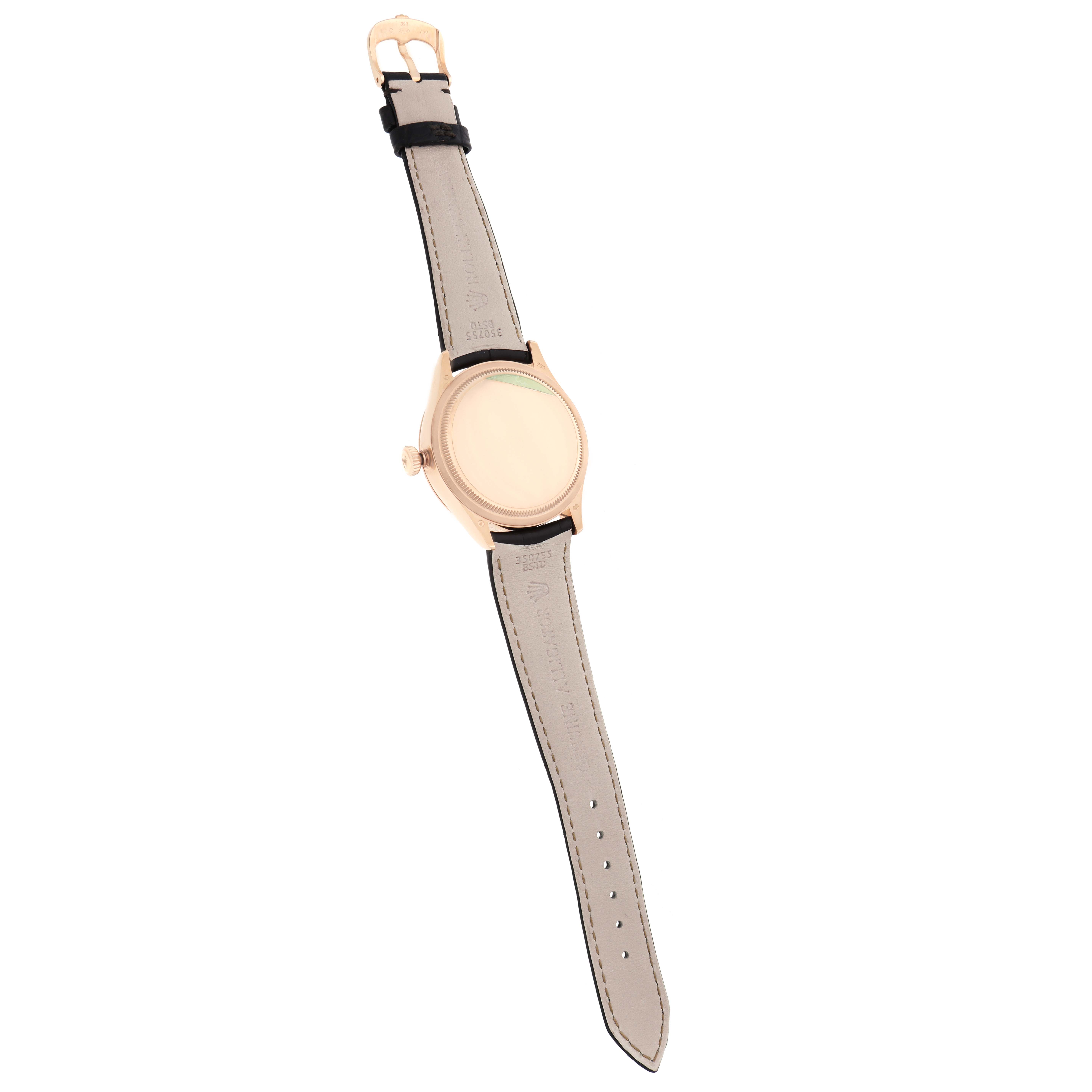 The Rolex Cellini 50525 Men
s Rose Gold Brown Dial watch is shown from the back, highlighting the case back, leather strap, and buckle.