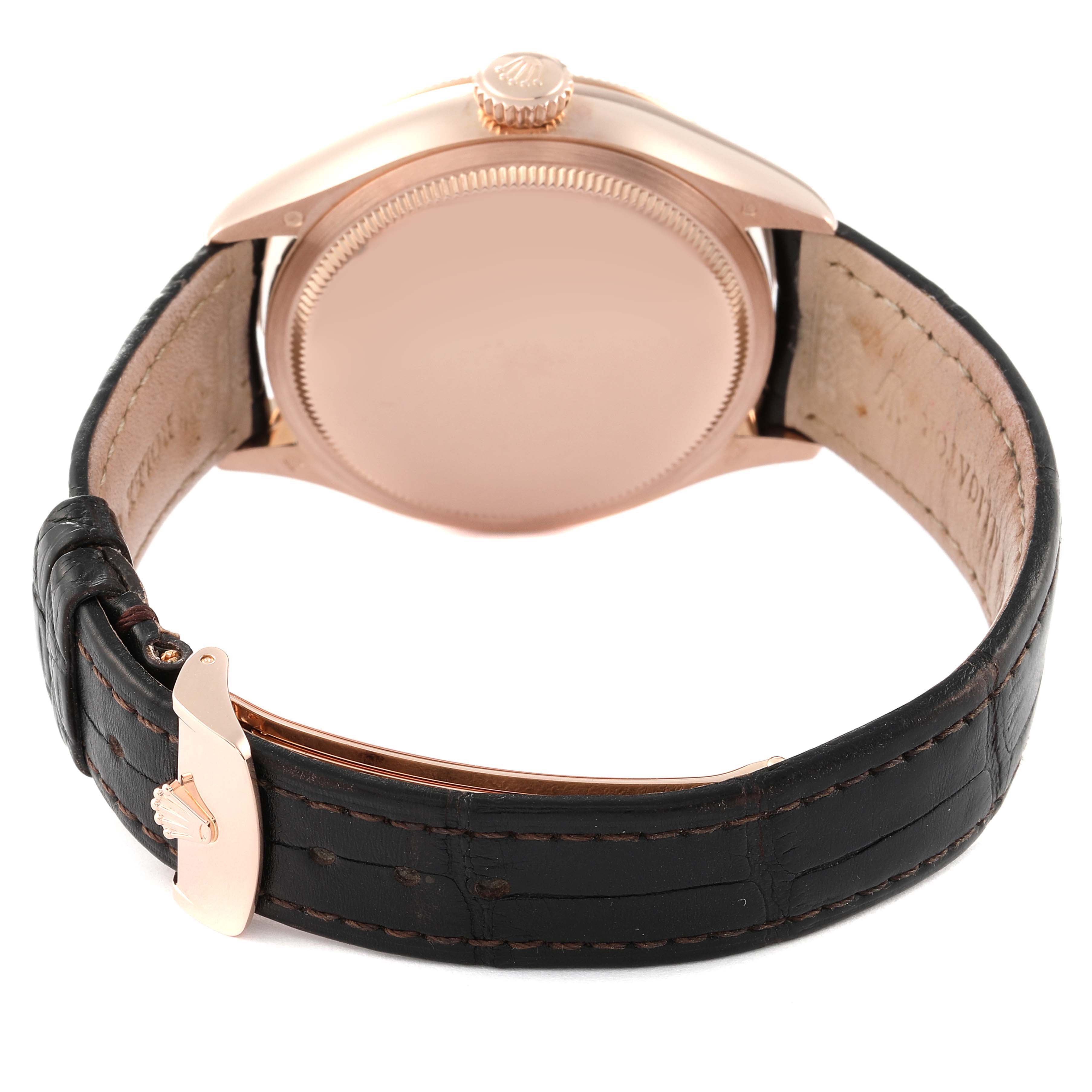 The image shows the backside and the leather strap of a Rolex Cellini 50535 Men's Rose Gold White Dial 50535 Men's Rose Gold White Dial watch, featuring its clasp and crown.