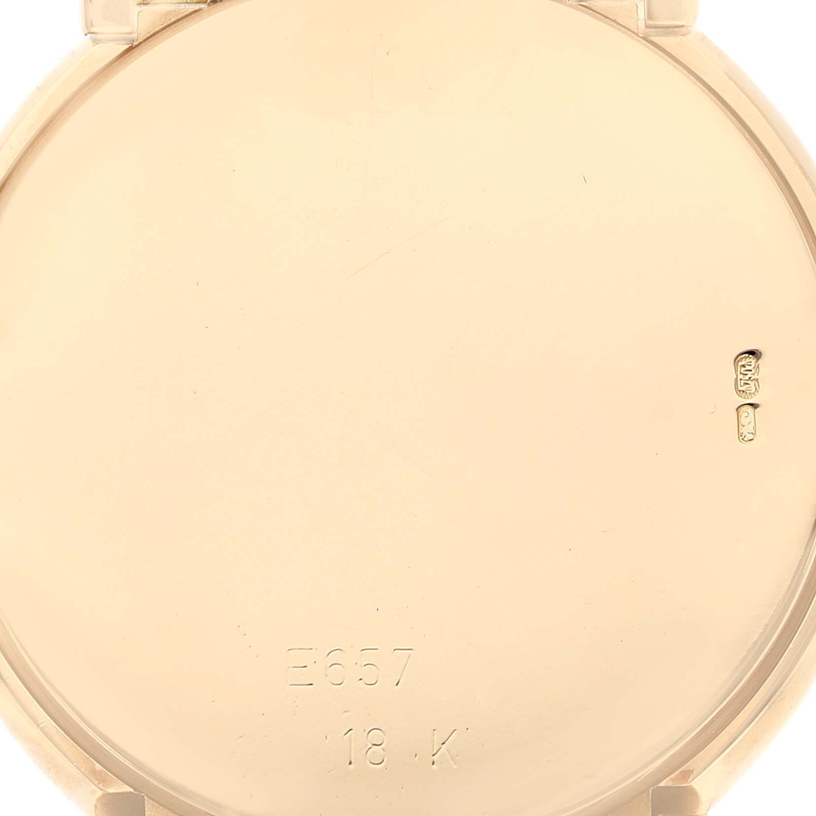 This image shows the back case of a Rolex Cellini 6622 Men
s Yellow Gold Champagne Dial 6622 Men
s Yellow Gold Champagne Dial watch, highlighting its 18K gold material and engraved markings.