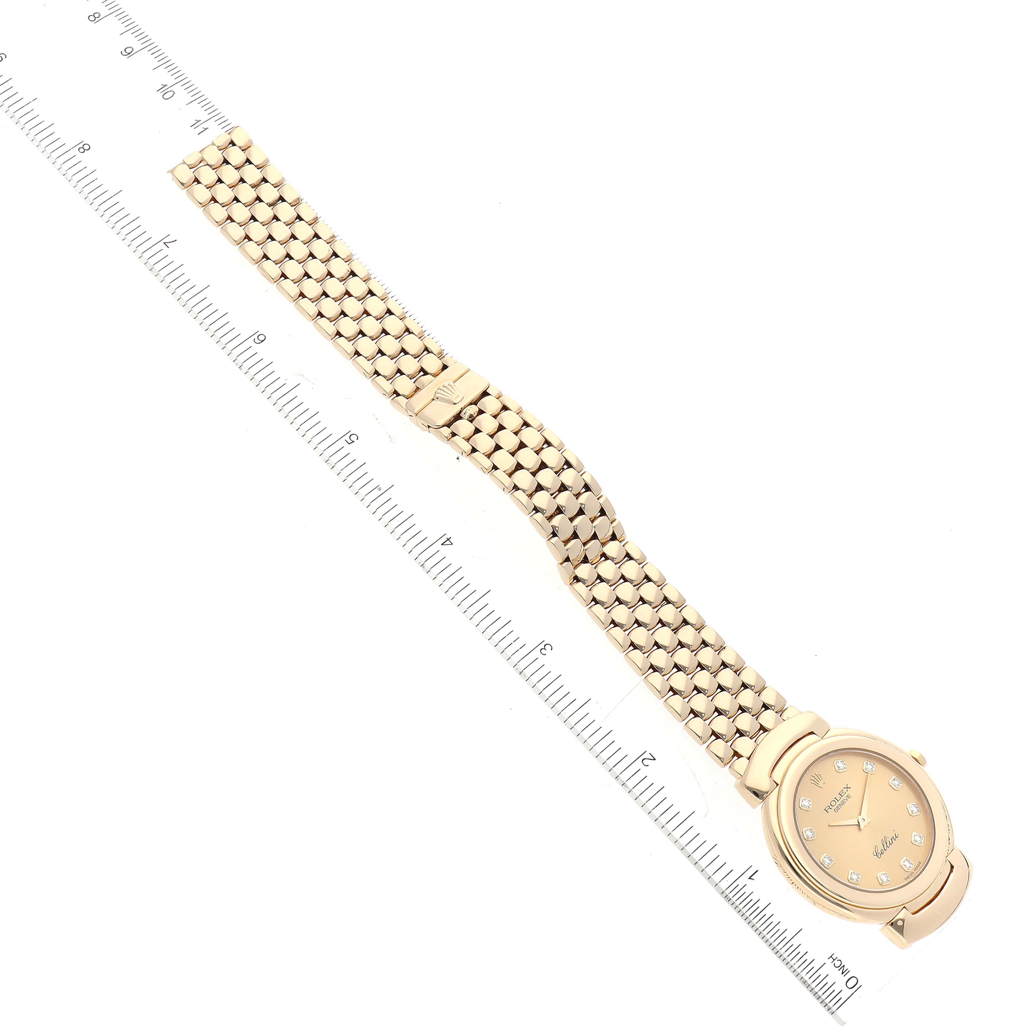 The image shows a Rolex Cellini 6622 Men
s Yellow Gold Champagne Dial 6622 Men
s Yellow Gold Champagne Dial watch laid flat with a ruler for scale, highlighting the face and bracelet.