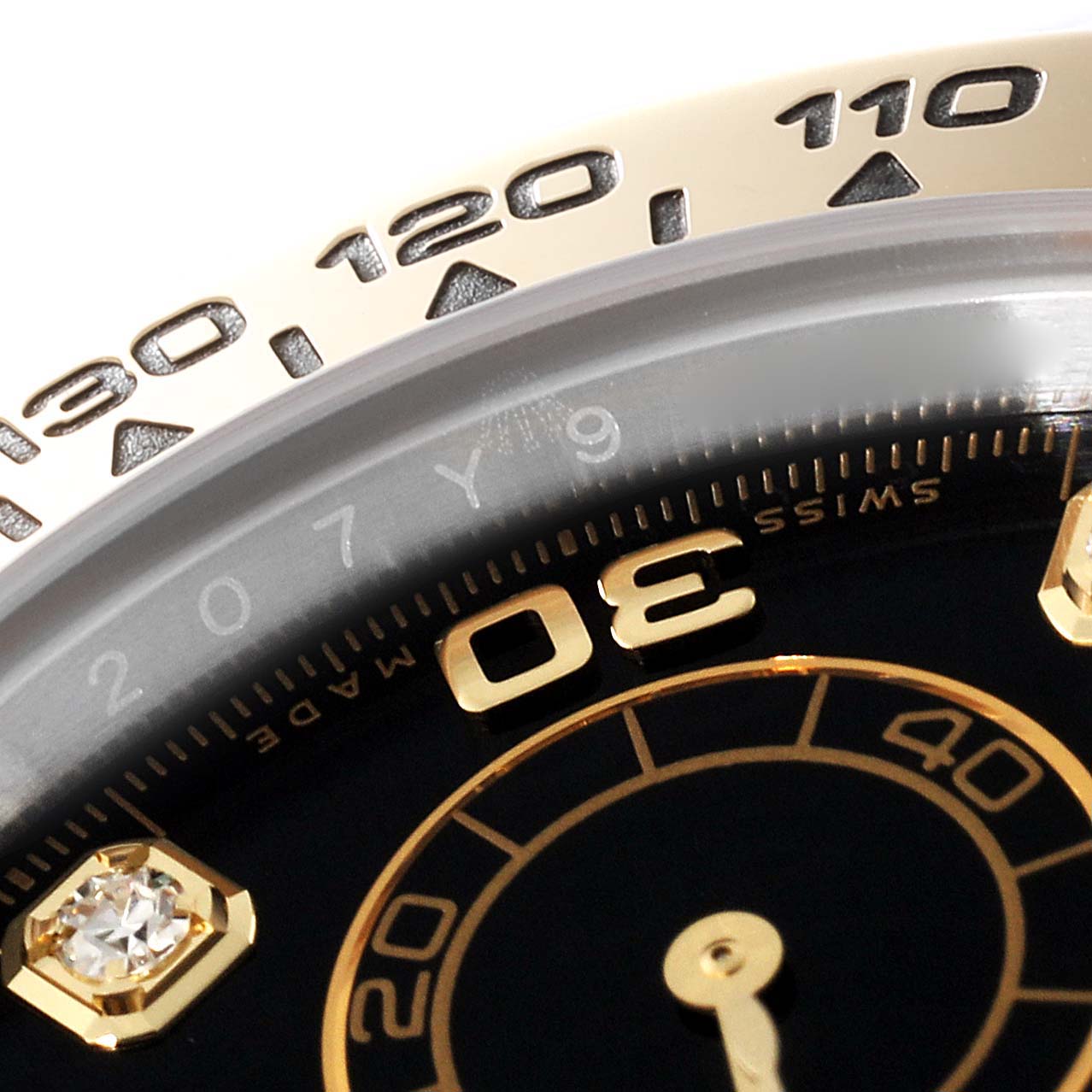 This image shows a close-up of the dial and bezel of a Rolex Daytona 116503 Men
s Steel and Gold (two tone) Black Dial 116503 Men
s Steel and Gold (two tone) Black Dial watch, focusing on the number 30 and part of the tachymeter scale.