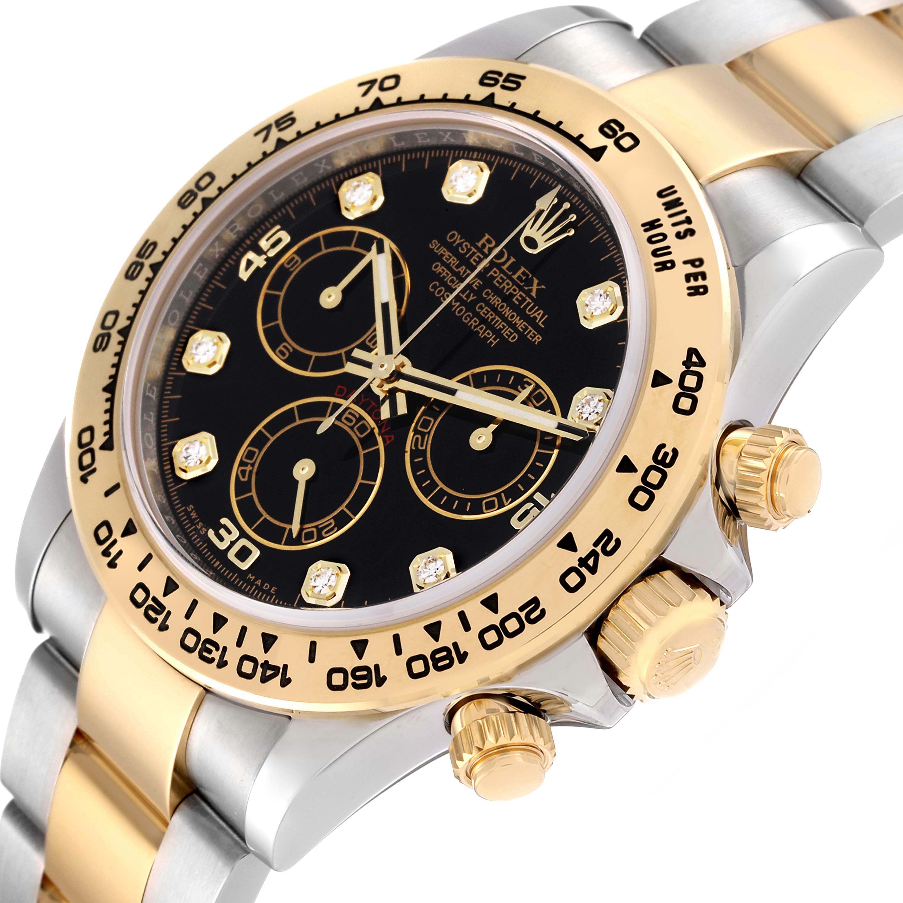 The image shows the face, bezel, crown, and two pushers of a Rolex Daytona 116503 Men
s Steel and Gold (two tone) Black Dial 116503 Men
s Steel and Gold (two tone) Black Dial watch angled to the right.