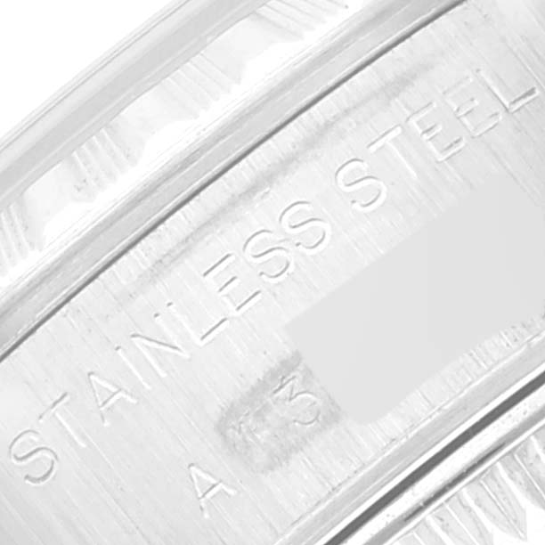 The image shows an angled close-up of the inner band of a Rolex Date 79240 Women's Stainless Steel Black Dial 79240 Women's Stainless Steel Black Dial model watch, displaying "STAINLESS STEEL" engraving.