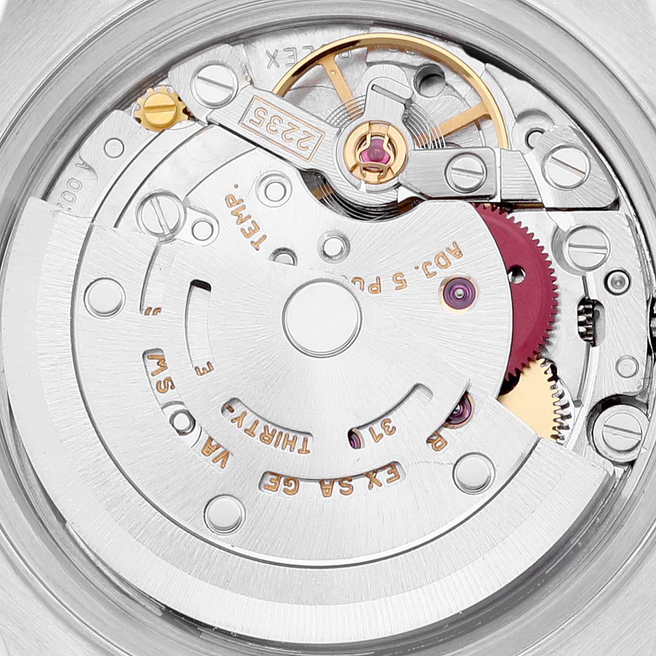 This close-up image shows the intricate inner workings of the Rolex Date 79240 Women's Stainless Steel Black Dial 79240 Women's Stainless Steel Black Dial model watch, highlighting gears and the rotor mechanism.