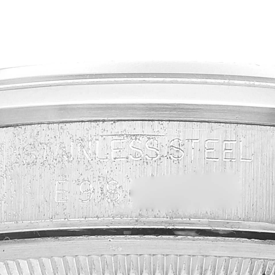 The image shows a close-up of the engraved case back of a Rolex Date 15200 Men
s Stainless Steel Silver Dial 15200 Men
s Stainless Steel Silver Dial model, highlighting the stainless steel material.