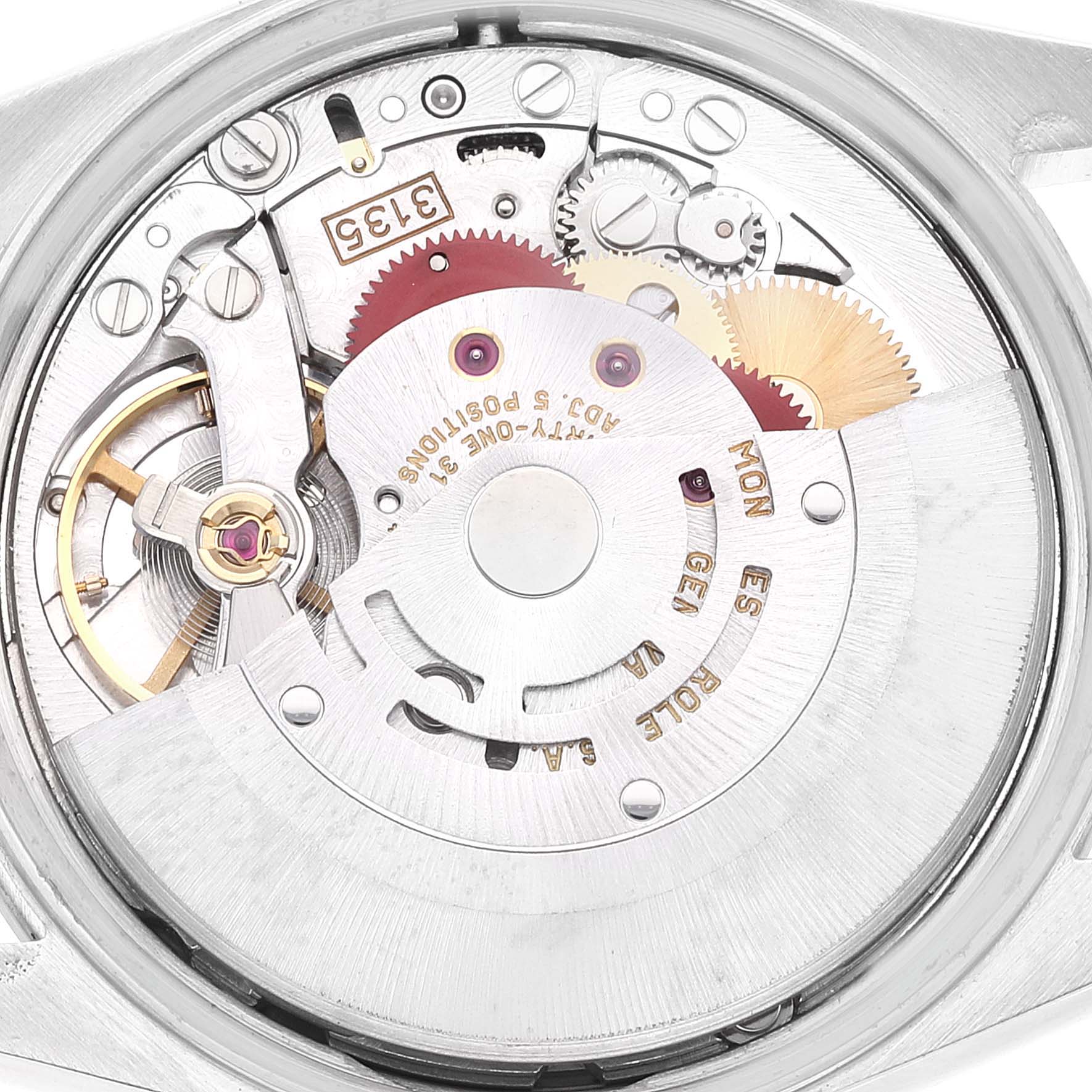 The image shows the internal mechanism of a Rolex Date 15200 Men
s Stainless Steel Silver Dial 15200 Men
s Stainless Steel Silver Dial model watch from a top-down angle, displaying its gears and components.