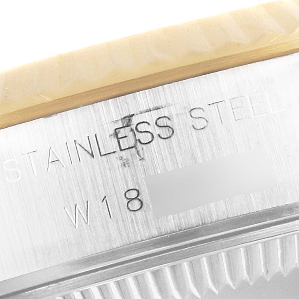 The image shows a close-up shot of the steel casing and engraving on a Datejust model by Rolex.