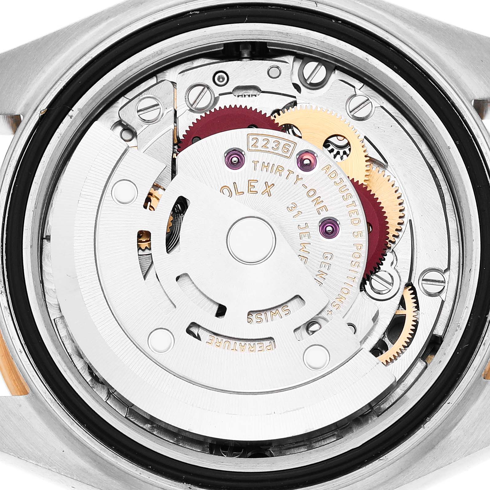 The image shows the back view of a Rolex Datejust 279173 Women's Steel and Gold (two tone) Champagne Dial, highlighting its intricate movement and gears.