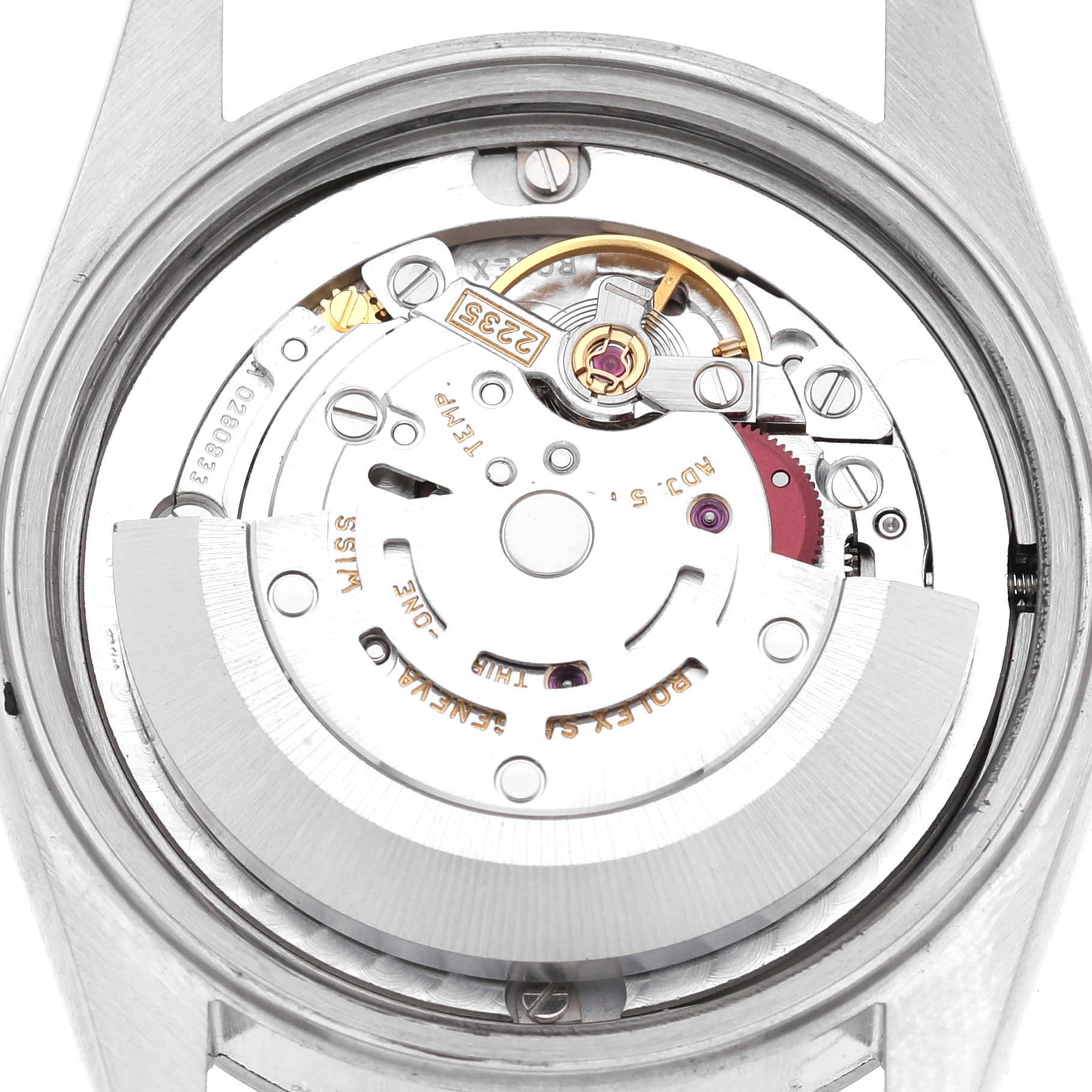 The image shows the back of a Rolex Mid-Size 78240 Women's Stainless Steel Silver Dial model watch, revealing its internal movement and mechanism.