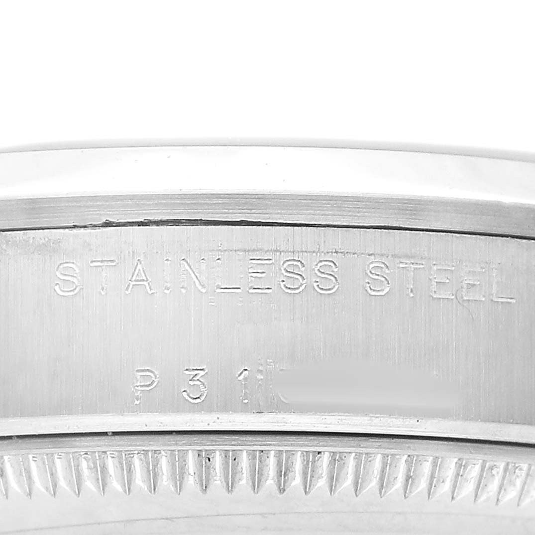 The image shows the engraved side of a Rolex Mid-Size 78240 Women's Stainless Steel Silver Dial model watch case, highlighting the stainless steel material.