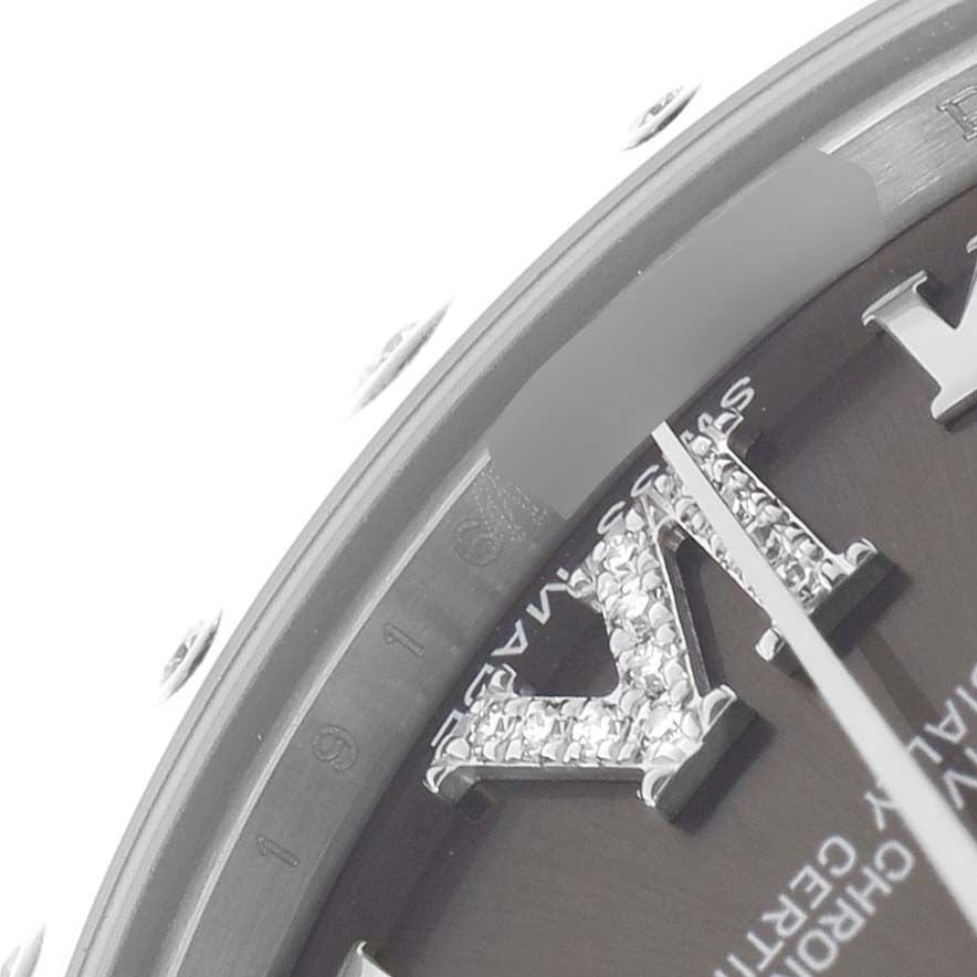 The image shows a partial close-up of the Rolex Datejust 178344 Women
s Stainless Steel Grey Dial watch, focusing on the bezel, dial, and embellished Roman numeral.