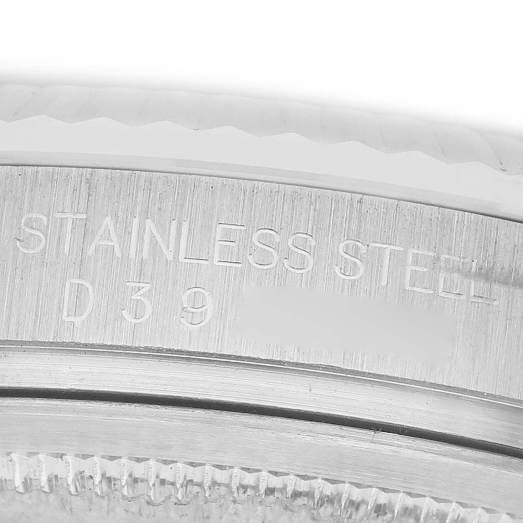 The image shows a close-up of the case back and edge of the bezel of a Rolex Datejust 116234 Men's Stainless Steel Mother of Pearl Dial watch, focusing on the "Stainless Steel" engraving.