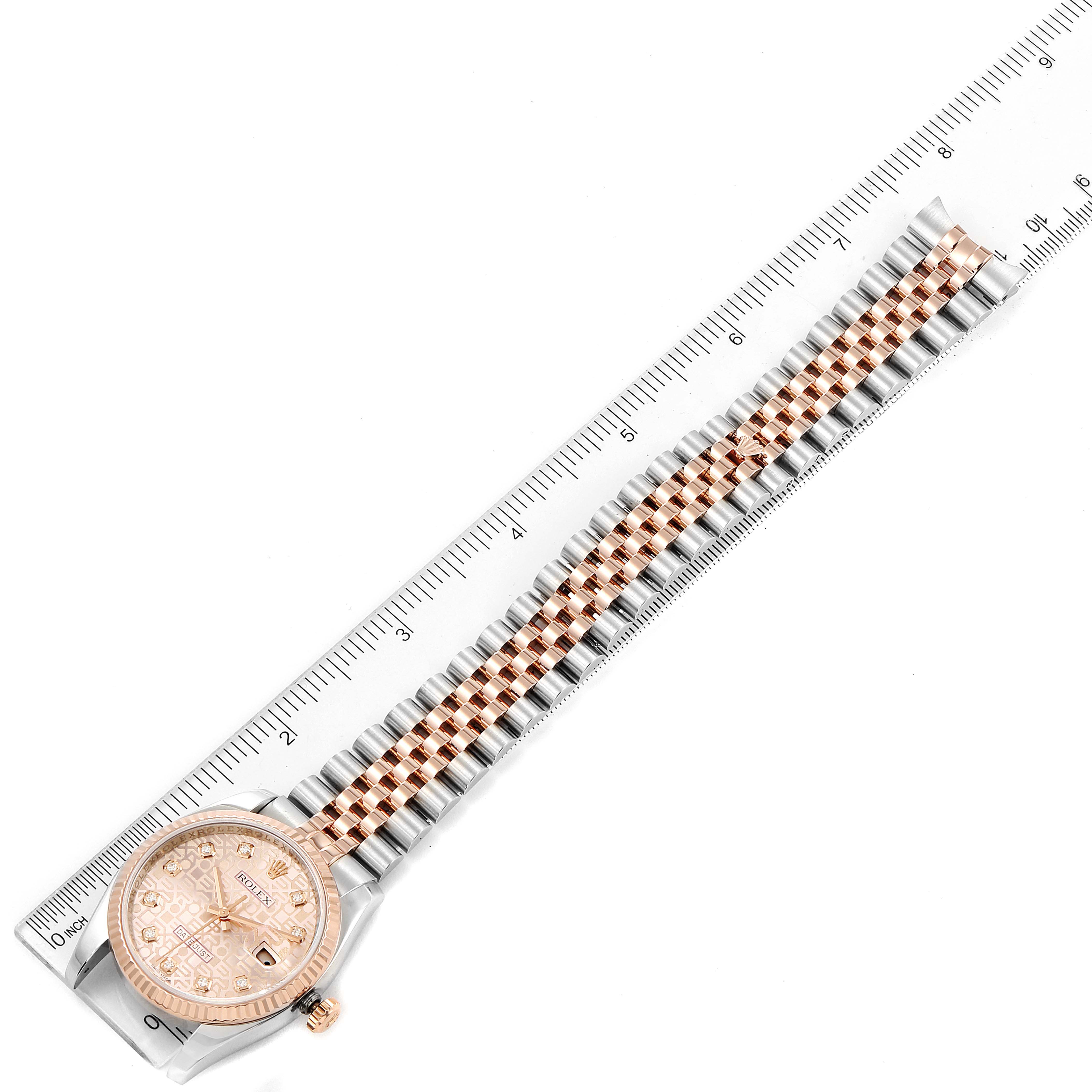 The image shows a Rolex Datejust 116231 Men's Steel and Gold (two tone) Pink Dial 116231 Men's Steel and Gold (two tone) Pink Dial watch, featuring its entire bracelet and dial, placed alongside a ruler for scale.