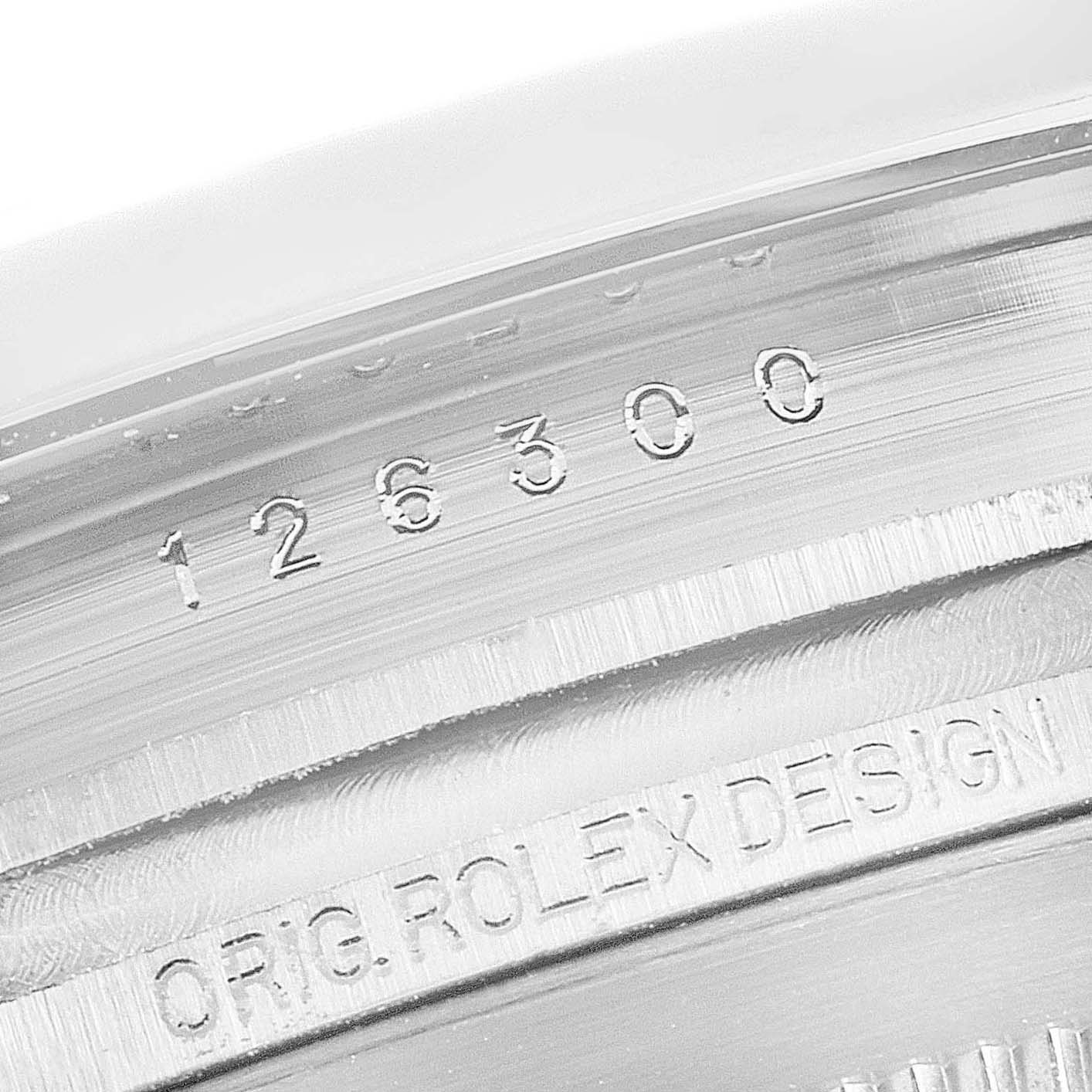 This close-up image shows the model number and "ORIG. ROLEX DESIGN" engraving inside the case of a Rolex Datejust 41 126300 Men's Stainless Steel Grey Dial 126300 Men's Stainless Steel Grey Dial watch.