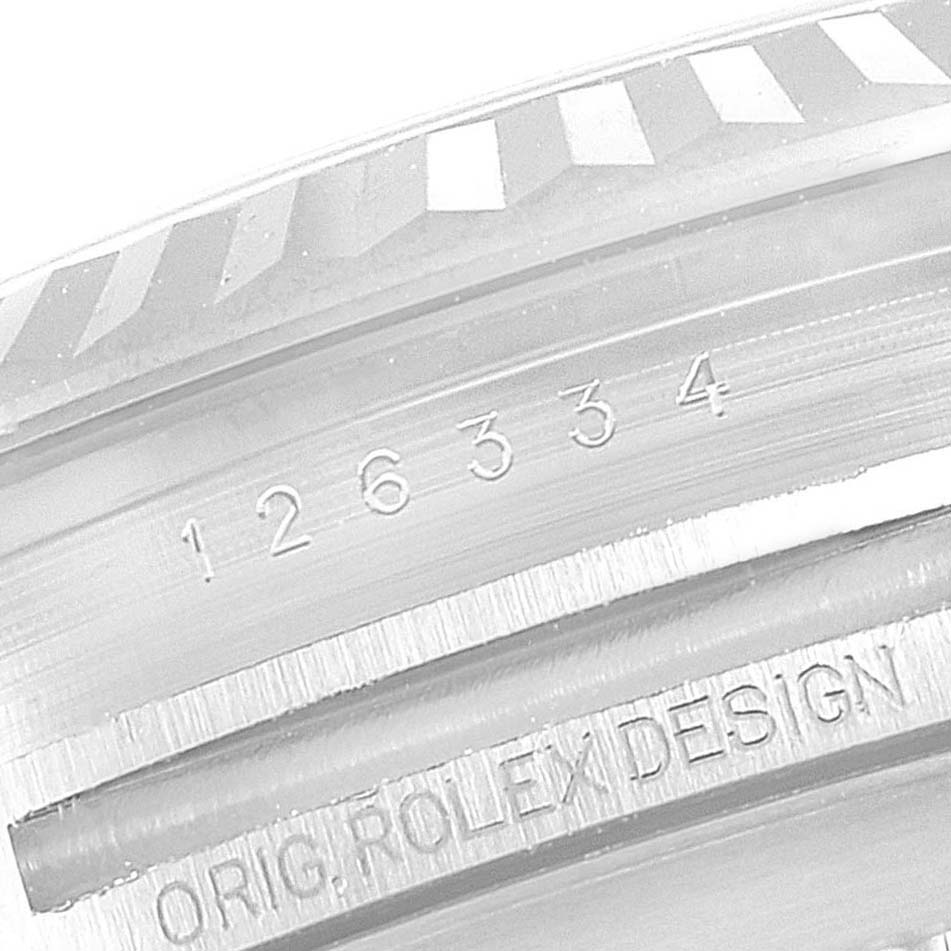 The image shows a close-up of the fluted bezel and engraved details on a Rolex Datejust 41 126334 Men's Stainless Steel Grey Dial 126334 Men's Stainless Steel Grey Dial model watch.