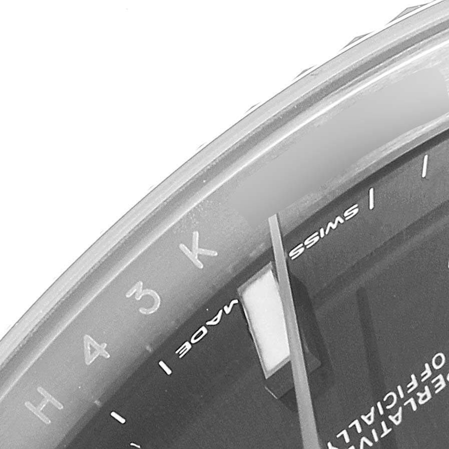 The image shows a close-up of the dial and bezel of the Rolex Datejust 41 126334 Men's Stainless Steel Grey Dial 126334 Men's Stainless Steel Grey Dial watch, focusing on part of the minute markers and text.
