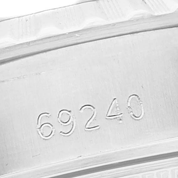 This image shows a close-up of the production number engraved on a Rolex Datejust 69240 Women's Stainless Steel Black Dial 69240 Women's Stainless Steel Black Dial watch case.