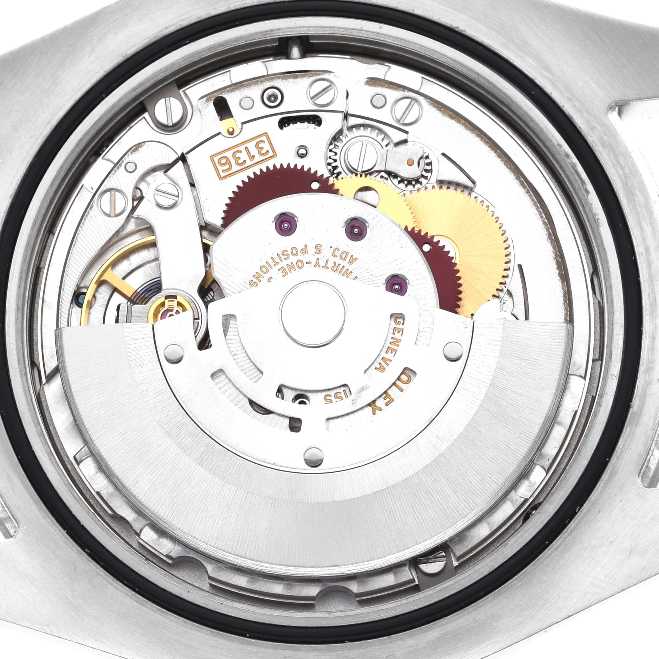 The image shows the movement of a Rolex Datejust 41 116334 Men
s Stainless Steel Blue Dial, viewed from the back, highlighting the rotor and gears.