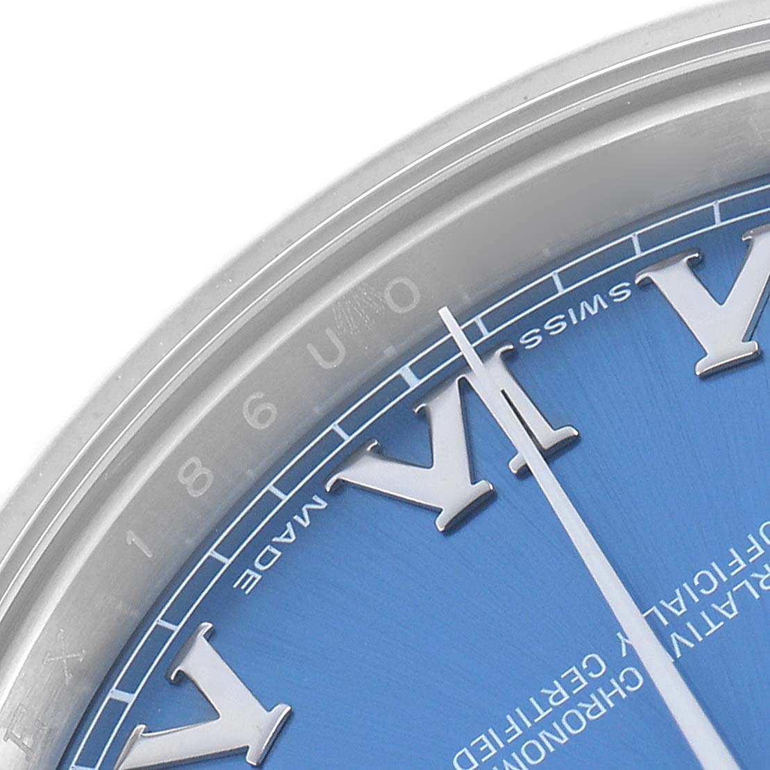 The image shows a close-up of the dial of a Rolex Datejust 41 116334 Men
s Stainless Steel Blue Dial, highlighting the roman numerals and the blue dial.