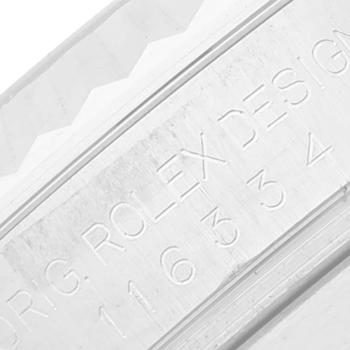 This close-up image shows the engraved inner bezel (rehaut) of a Rolex Datejust 41 116334 Men's Stainless Steel White Dial 116334 Men's Stainless Steel White Dial watch.