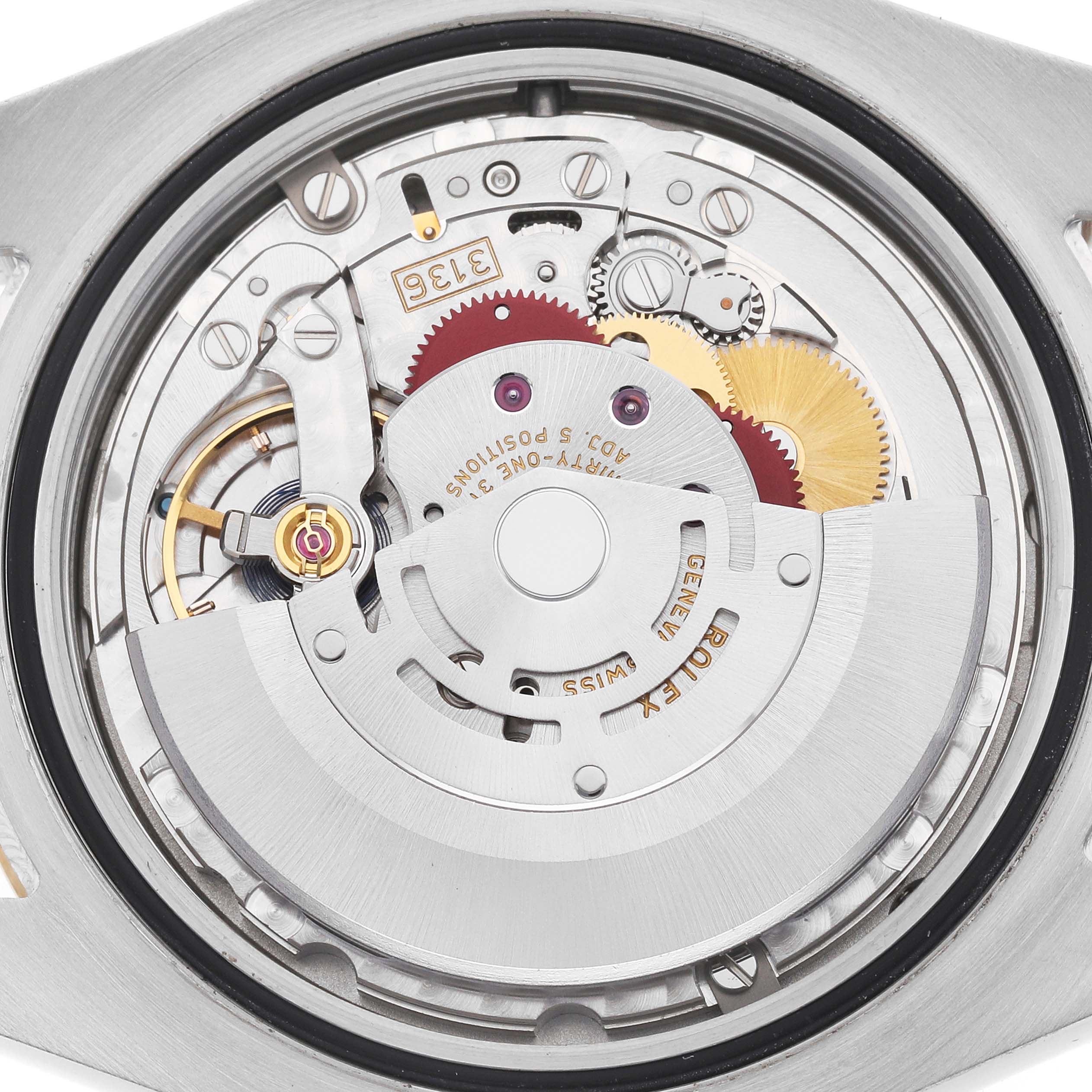 The image shows the inner mechanism of a Rolex Datejust 41 116333 Men
s Steel and Gold (two tone) Silver Dial watch, highlighting gears and the rotor.