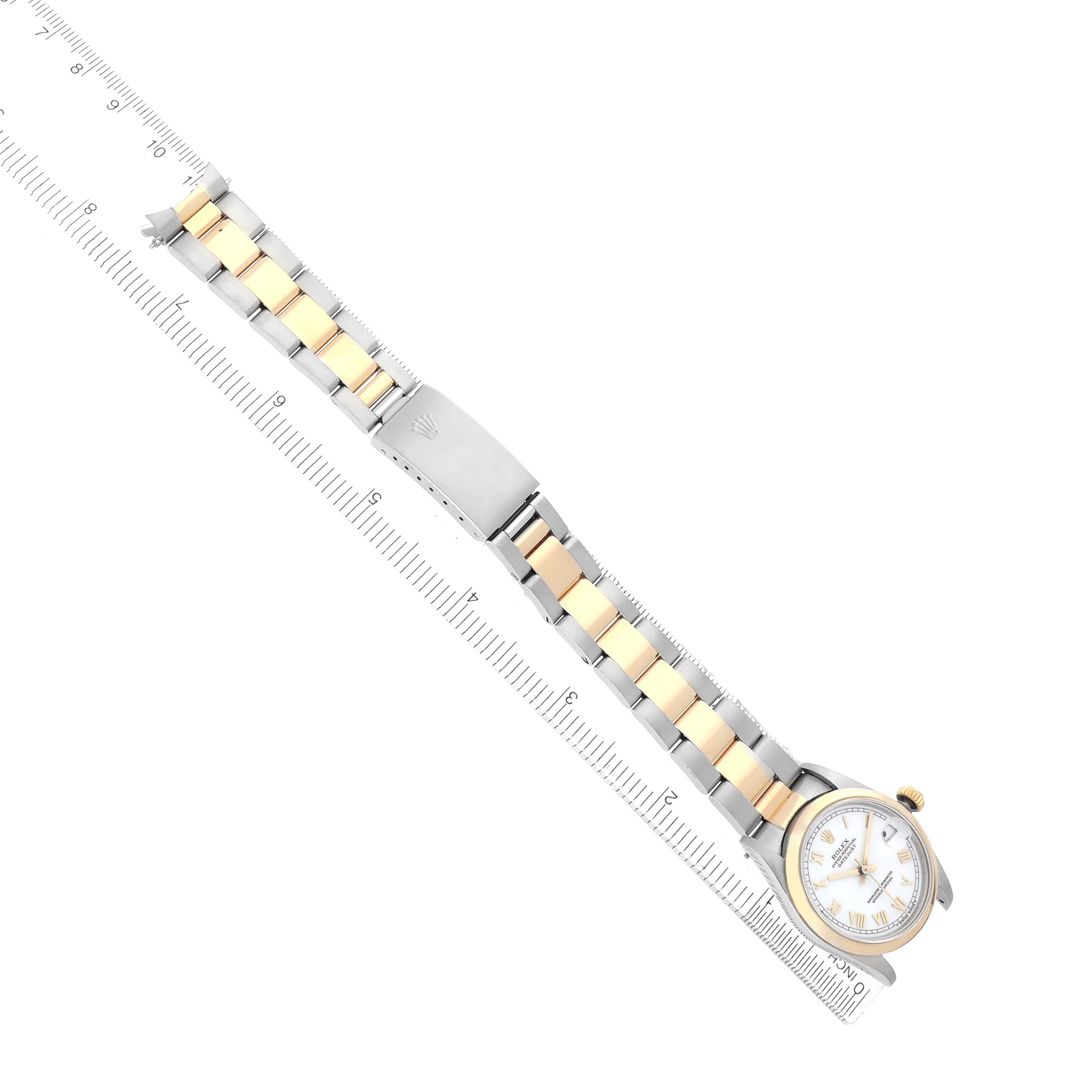 The Rolex Datejust 68243 Women
s Steel and Gold (two tone) White Dial watch is shown at a diagonal angle, highlighting the full bracelet with silver and gold links.