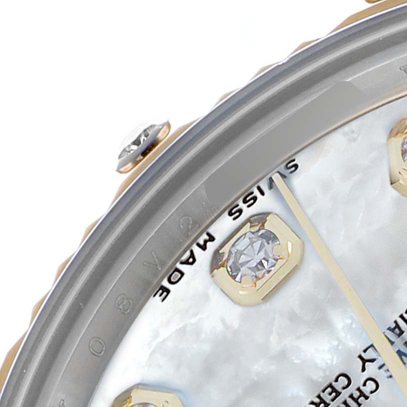 The image shows a partial close-up of the Rolex Datejust 178313 Men
s Steel and Gold (two tone) Mother of Pearl Dial
s watch face, highlighting the bezel, diamond markers, and "Swiss Made" text.