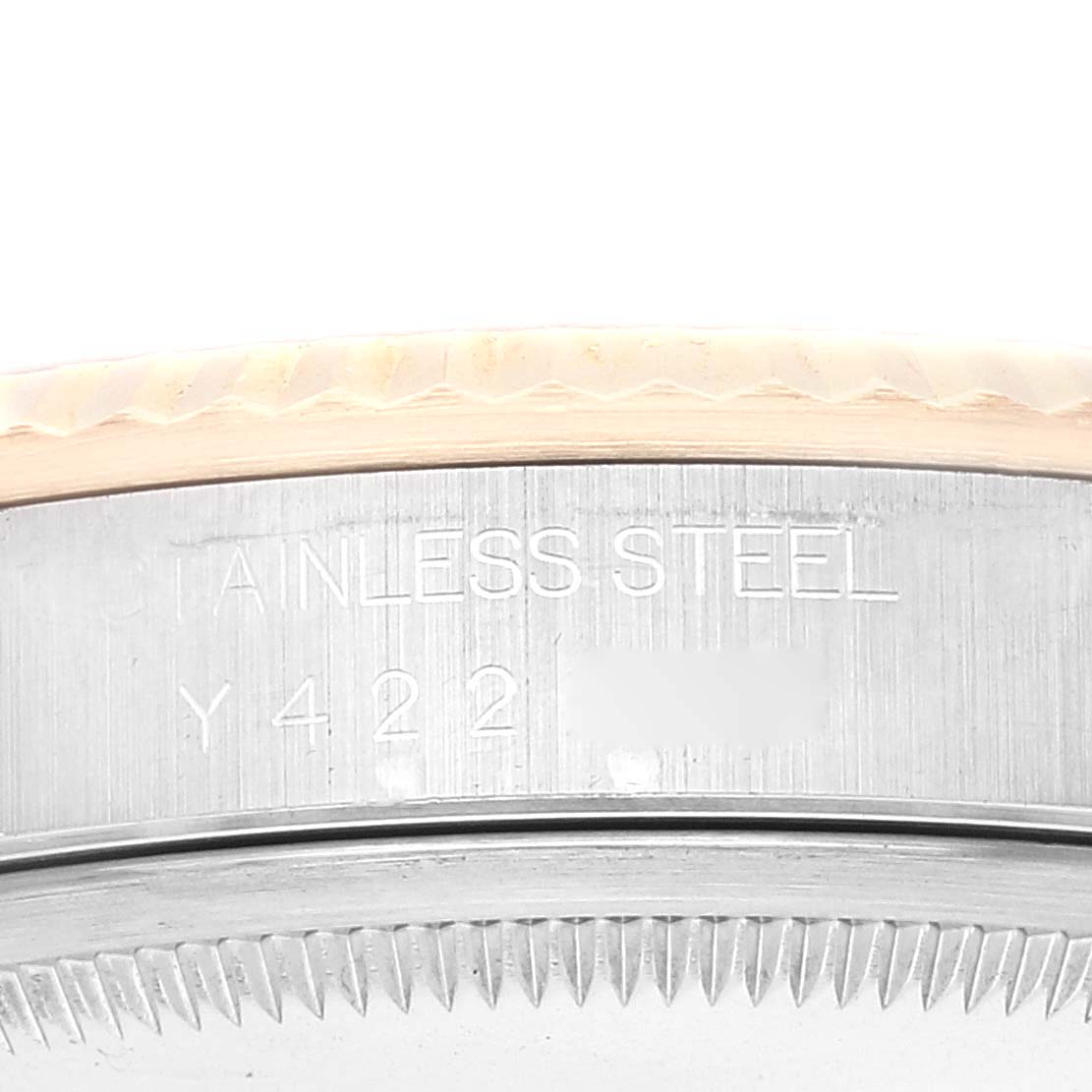This close-up image shows the side of the case for a Rolex Datejust 16233 Men's Steel and Gold (two tone) Silver Dial 16233 Men's Steel and Gold (two tone) Silver Dial, highlighting the stainless steel engraving.