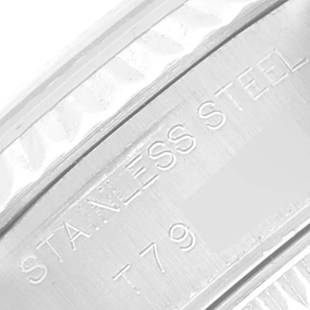 The image shows a close-up of the stainless steel casing and part of the fluted bezel of the Rolex Datejust 69174 Women's Stainless Steel Mother of Pearl Dial 69174 Women's Stainless Steel Mother of Pearl Dial watch.