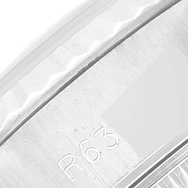 The image shows a close-up of the bezel and part of the case back of a Rolex Datejust 69174 Women's Stainless Steel Silver Dial 69174 Women's Stainless Steel Silver Dial.