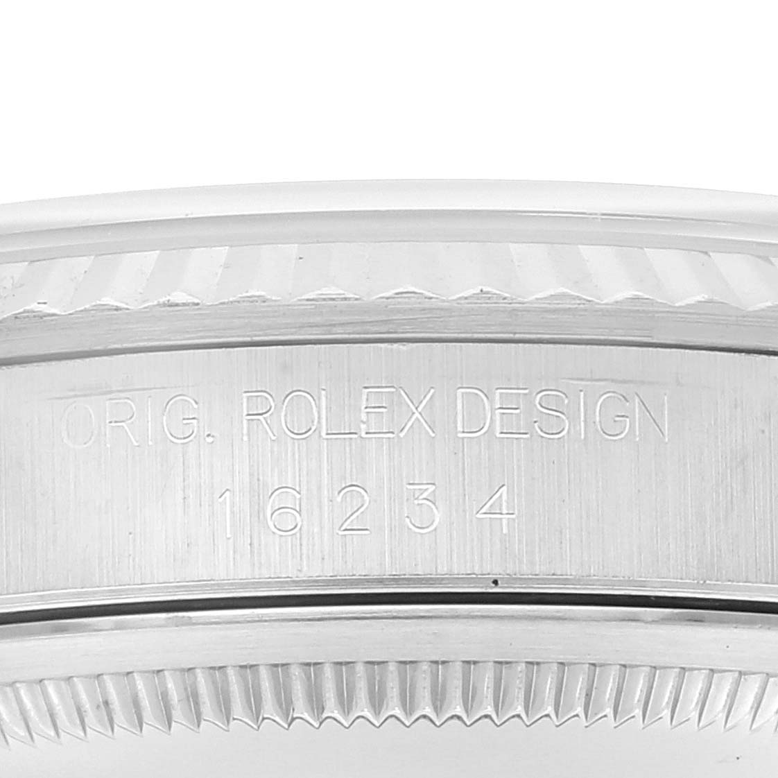 This image shows an up-close view of the side case of a Rolex Datejust 16234 Men's Stainless Steel Silver Dial 16234 Men's Stainless Steel Silver Dial, specifically highlighting the model number "16234" and the inscription "ORIG. ROLEX DESIGN."