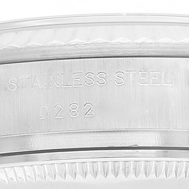 The image shows a close-up of the side of a Rolex Datejust 179174 Women's Stainless Steel White Dial 179174 Women's Stainless Steel White Dial watch, displaying the stainless steel engraving and partial reference number.