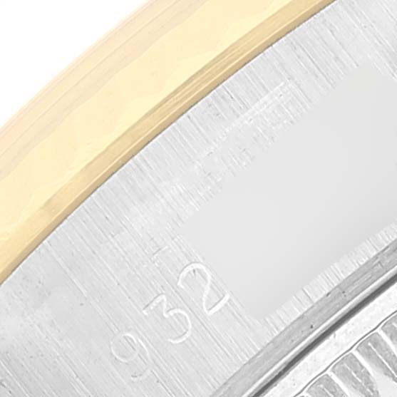 This close-up image shows part of the bezel and engraving on a Rolex Datejust 69173 Women's Steel and Gold (two tone) Silver Dial 69173 Women's Steel and Gold (two tone) Silver Dial watch.
