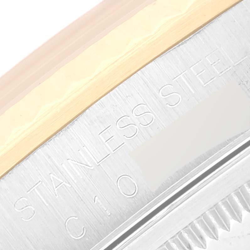 This close-up image showcases the engraving on the stainless steel rim of the Rolex Datejust 16233 Men's Steel and Gold (two tone) White Dial 16233 Men's Steel and Gold (two tone) White Dial model.