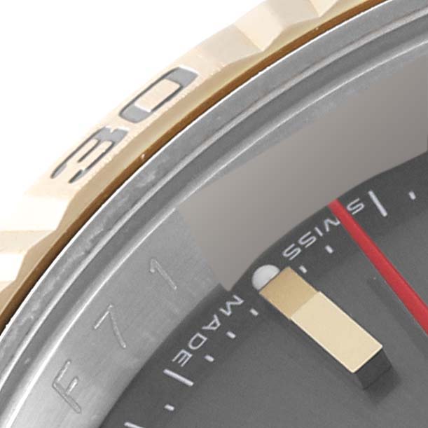This close-up image shows the bezel, part of the dial, and the hour marker of the Rolex Turn-o-Graph 116263 Men's Steel and Gold (two tone) Grey Dial 116263 Men's Steel and Gold (two tone) Grey Dial watch.