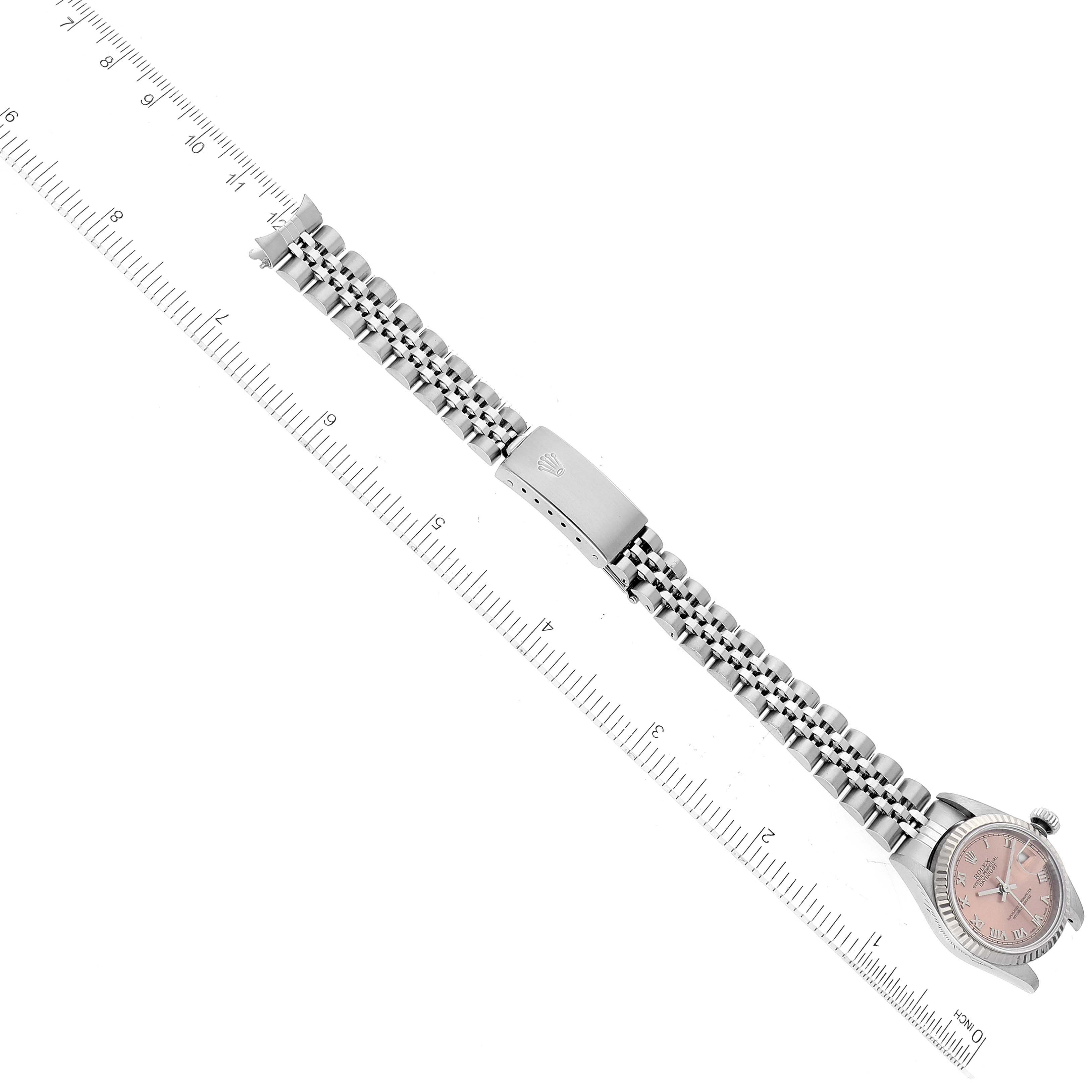 The image shows a Rolex Datejust 79174 Women's Stainless Steel Pink Dial 79174 Women's Stainless Steel Pink Dial watch laid flat, highlighting the band, clasp, and dial from a top-down angle.