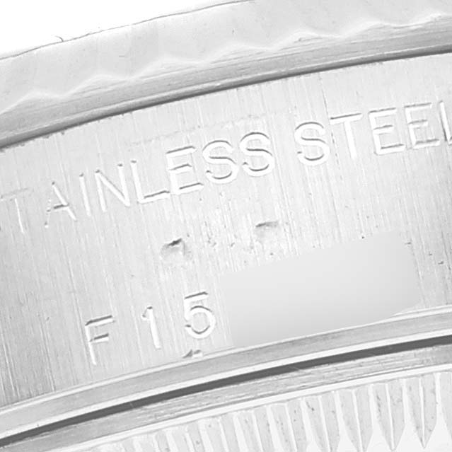 This is a macro shot of the casing showing the stainless steel marking on a Rolex Datejust 79174 Women's Stainless Steel Pink Dial 79174 Women's Stainless Steel Pink Dial watch.