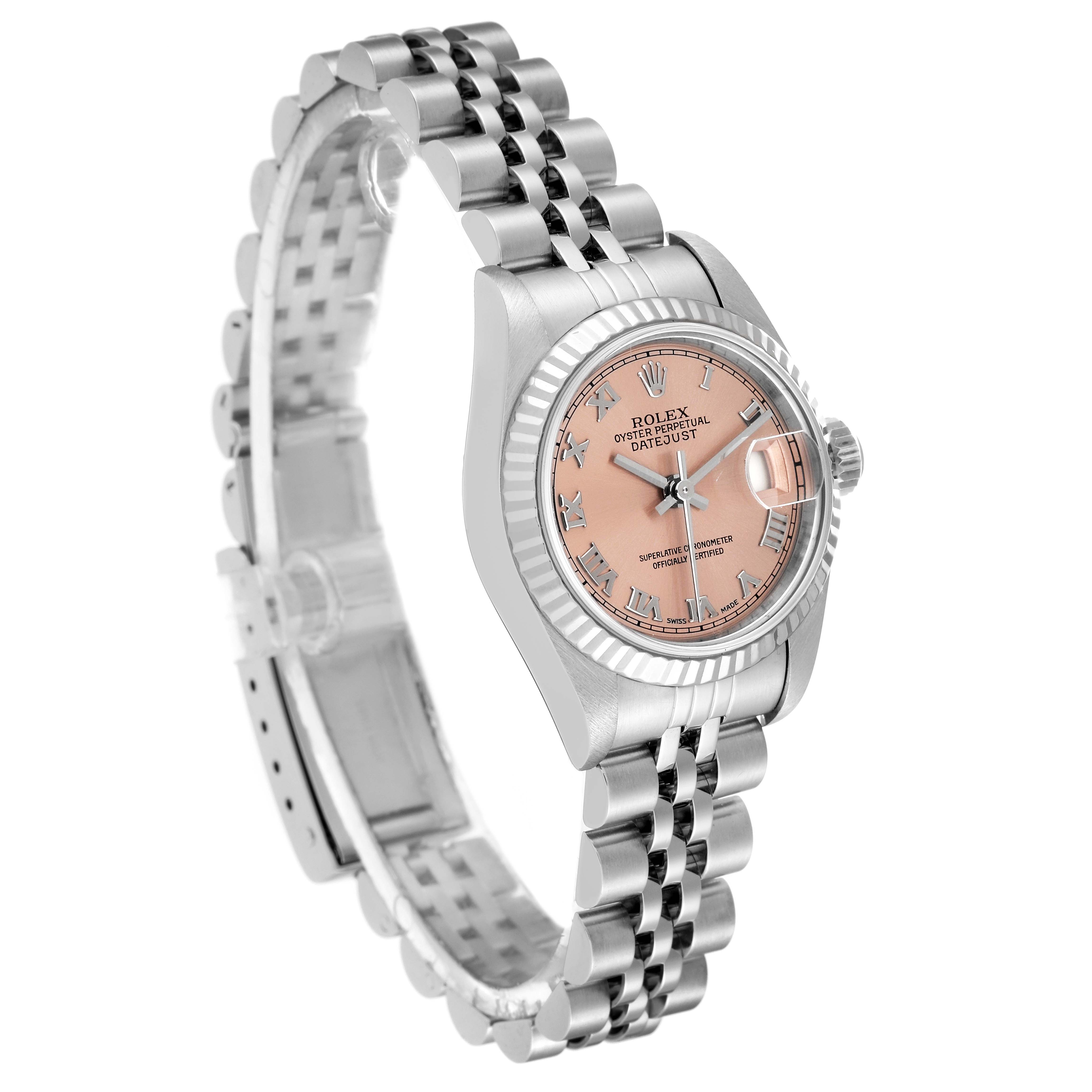 The image shows a Rolex Datejust 79174 Women's Stainless Steel Pink Dial 79174 Women's Stainless Steel Pink Dial with a pink dial, stainless steel jubilee bracelet, and fluted bezel, viewed from a 3 o'clock angle.