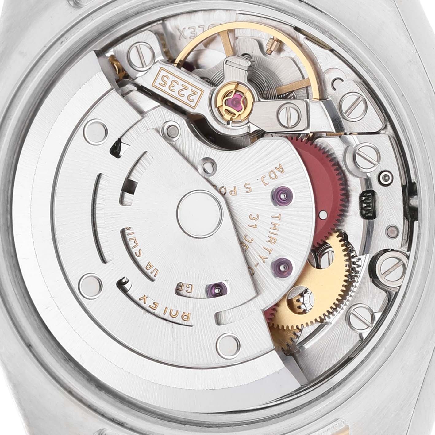 This image shows the movement of a Rolex Datejust 179383 Women's Steel and Gold (two tone) Champagne Dial watch from the back, highlighting the rotor and internal gears.