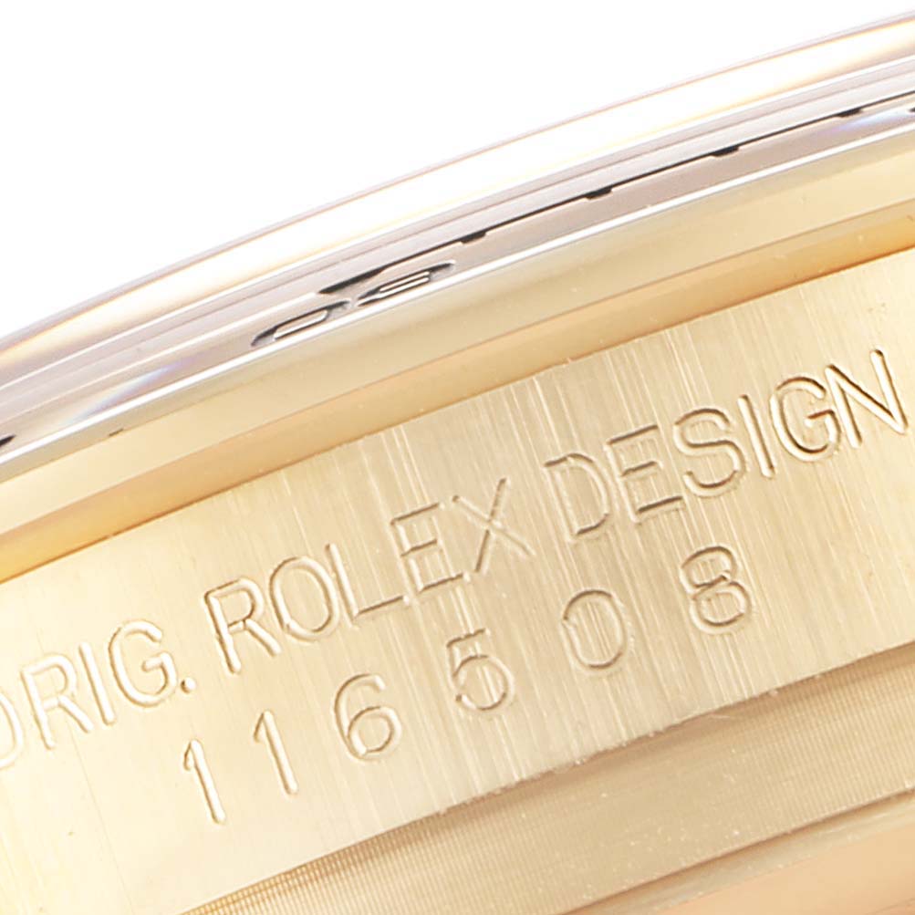 This close-up angle shows the edge of a Rolex Daytona 116508 Men's Yellow Gold Green Dial 116508 Men's Yellow Gold Green Dial watch case, highlighting the engraved model number 116508.