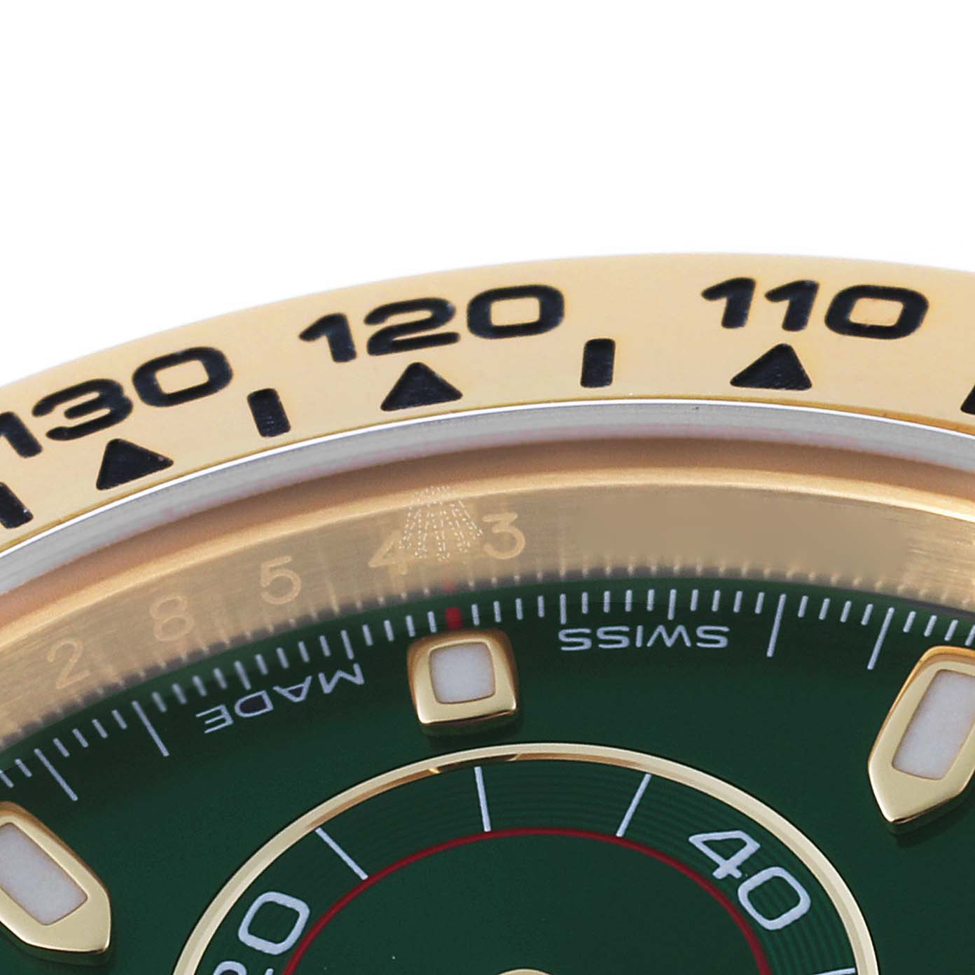 Close-up of the dial and part of the bezel of the Rolex Daytona 116508 Men's Yellow Gold Green Dial 116508 Men's Yellow Gold Green Dial watch, showing details and markings.