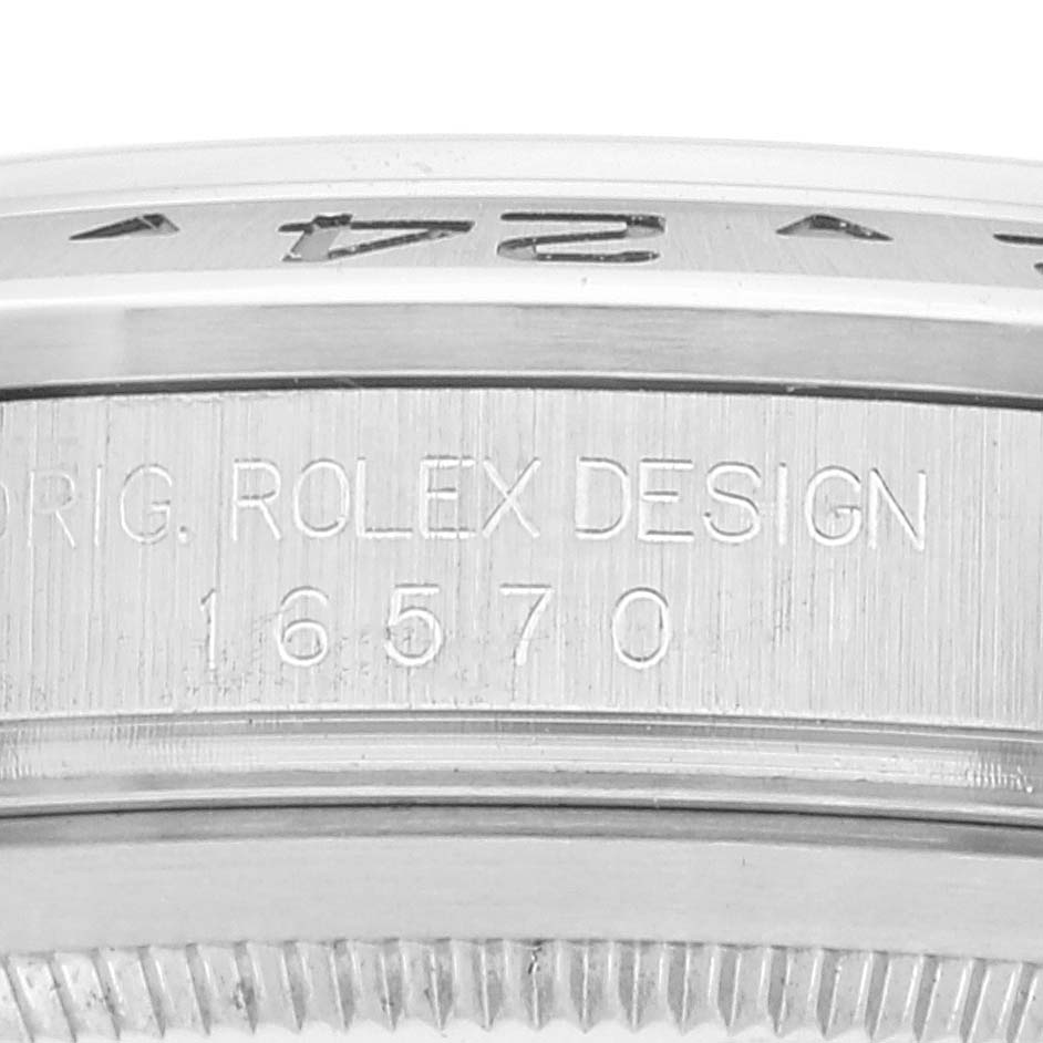 The image shows a close-up of the engraved casing of a Rolex Explorer 16570 Men
s Stainless Steel White Dial 16570 Men
s Stainless Steel White Dial model 16570.