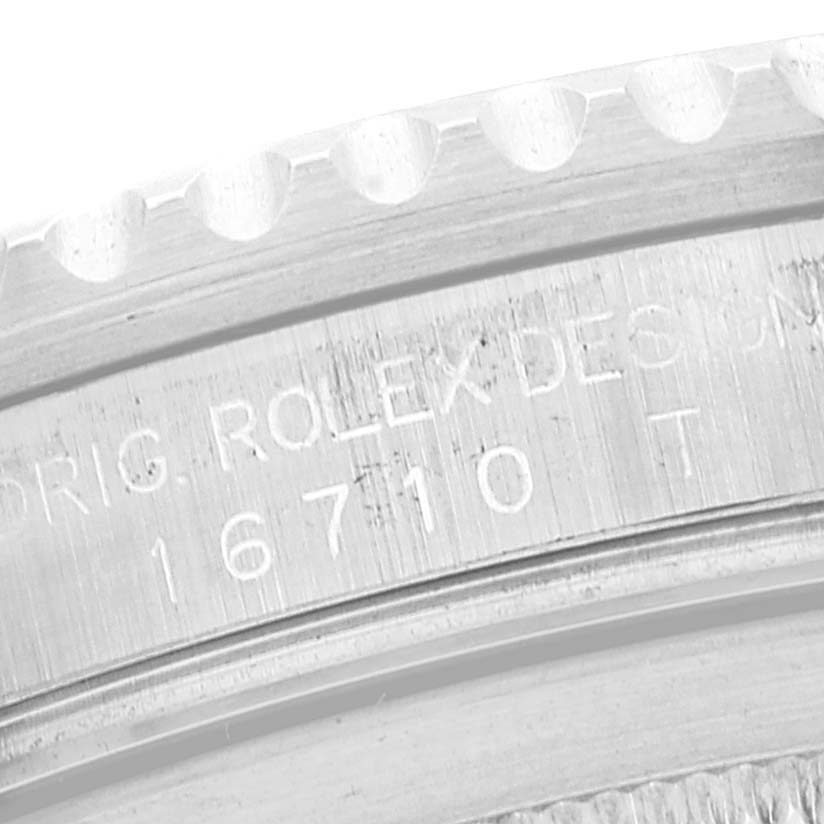 This close-up image shows the engraved reference number and part of the bezel on a Rolex GMT-Master 16710 Men
s Stainless Steel Black Dial 16710 Men
s Stainless Steel Black Dial watch.