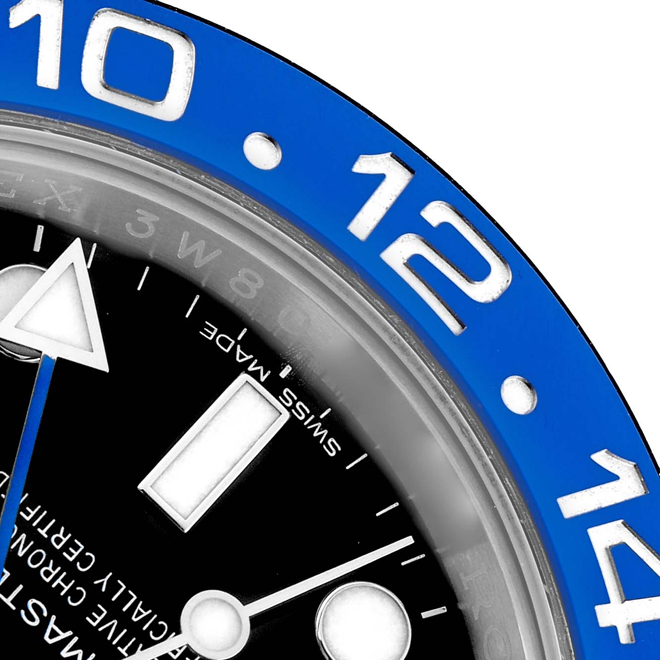 The image shows a close-up of the Rolex GMT-Master 116710 Men
s Stainless Steel Black Dial
s blue bezel and part of the dial with hour markers and a hand.